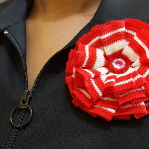 Red and White Stripe Rosette Broach With Decorative Transparent Pearl Drop Center